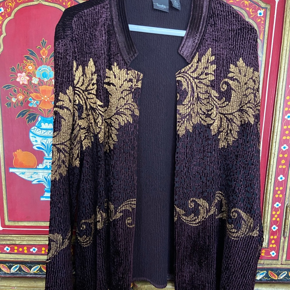 This elegant jacket in purple comes from the Chico’s Traveler’s Collection.